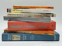 Stack of 7 Virginia Woolf themed books showing titles and publishers on spines, arranged horizontally for clarity.