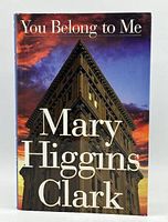 Front cover of the book showing title and author name over a building image with dramatic sky.