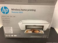 Box front showing HP DeskJet 2652 wireless home printing printer specifications and image.