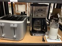 Photo of Zwilling four-slot toaster and Cuisinart coffee maker with Salton coffee grinder on table