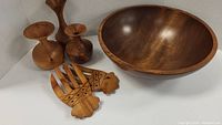 Set including large wooden salad bowl, wood salad tongs with geometric design, and the three wooden vases.