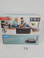 Box front showing brand Embark, queen size air mattress with built-in pump, usage, and warning label.