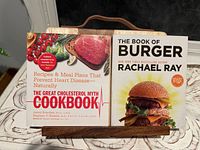 Cookbook holder with two cookbooks displayed, showing titles and cover design.