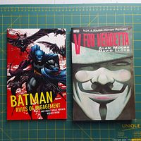 Front cover of Batman Rules of Engagement and V for Vendetta paperbacks showing artwork and titles.