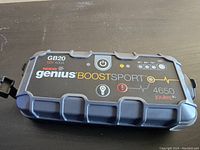 Top front view of the NOCO Genius Boost Sport GB20 jump starter showing power button, brand, model, and battery indicator lights.
