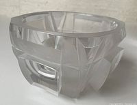 Frosted and clear geometric design crystal bowl viewed from front showing angular cutouts and faceting.