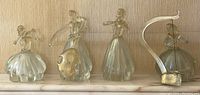 All four Murano glass musician figurines grouped in a row