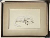 Framed watercolor painting of a dog, showing the dog lying down in a soft and delicate style.