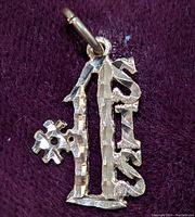 Front view of 10K gold pendant showing the detailed number 16 design with attached # symbol on purple background.