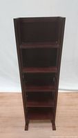 Front view of the foldable narrow 5-tier bookshelf in cherry brown wood showing all five shelves and standing upright.