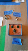 Photo showing all three jewelry items labeled: Moonstone ring, 10K Cameo ring, Genuine Jade earrings and necklace set in a box.