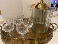 Photo showing entire set with brass tray, ice bucket with brass lid and handle, and 6 brandy glasses arranged on tray.
