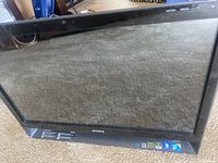 Front view of the Sony Vaio all-in-one touchscreen computer showing the screen and black bezel.