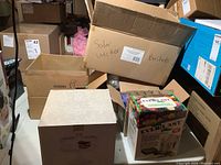 Boxes containing solar wicker baskets, EverLast flower preserving kit and additional boxes