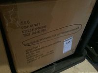 Close-up image showing product details on cardboard box with brand, size, color, and origin information.