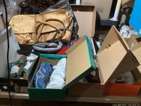 Overview of purses on top shelf and shoe boxes below