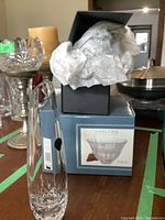 Two Waterford Shelton crystal vases shown with one new Shelton bowl in original box behind.