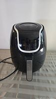 Black Tristar PowerXL air fryer front view with handle and cord visible