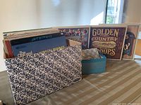 Box with vinyl records from a different angle, showcasing additional albums and overall condition.