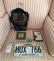 Full group photo of all five items on pink and white striped upholstery chair