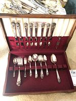 Flatware set in original box, showing full set with matching handles and organized slots.