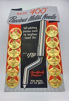 Full view of original vintage cardboard retail display holding 12 Walco 400 Precious Metal needles in foil packaging with pricing and product claims.
