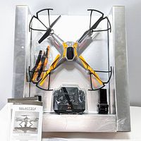 Photo showing drone, remote, manuals, battery and accessories in original half packaging without outer box.