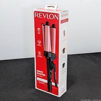 Front view of Revlon Wave Master hair styler packaging showing the product image, branding, and key features on the box.