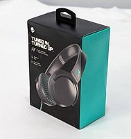 Front view of the Skullcandy Riff headphone box showing headphones image, brand, and tagline 'Tuned In, Turned Up'.