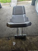 Top view of adjustable eyelashe/makeup chair showing padded upholstery and adjustable back section.