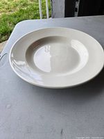 Photo showing one large white ceramic soup bowl, heavy duty with a wide rim and smooth finish.
