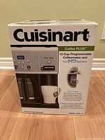 Box of Cuisinart coffee maker featuring product image and key features branding.