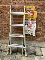 Front view of folded Cosco ladder with attached product label showing 17-foot, 5-position features.