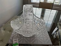 Bohemian cut crystal display basket on table, showing broad side and detailed cuts.
