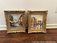 Front view of both gold framed paintings side by side against wall