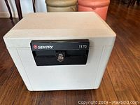 Front view of the fireproof safe showing the Sentry logo, model 1170, and keyhole.