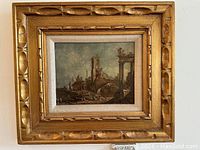Full front view of the vintage framed painting showing the Italian ruins scene, carved wood frame and canvas matting.
