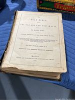 Top image showing the title page with publication details and author, indicating it's an antique Holy Bible from 1867 missing the front cover and with spine damage.