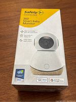 Front view of the Safety 1st 360 Smart Baby Monitor box showing the product image, features like app control, 1080p HD video, night vision, and smart home compatibility.