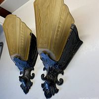 Two sconces angled upright showing overall design and matching pair