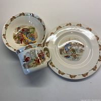 Full set showing handled cup, bowl, and plate with bunny borders and mid-century style rabbit illustrations.