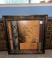 Full view of large framed bamboo-themed wall art showing entire piece with frame and artwork.