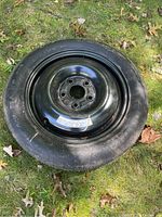 Top view of the spare tire showing black steel rim and overall tire condition