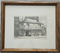 Frontal image of the framed etching showing the 'Old Curiosity Shop' scene with a wooden frame and white mat.