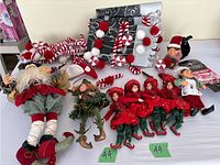 Full lot including elves, Santa, Christmas helper dolls, and garland with candy canes and pom-poms