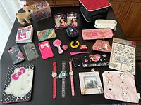 Full lot with all items including watches, pouches, temporary tattoos, music box, optical illusions book, cellphone cases.