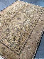 Full view of rectangular rug showing overall geometric and floral pattern