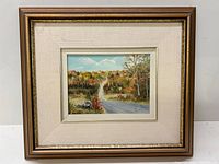 Framed oil on board painting titled 'Muskoka Road' by J. Cressman depicting an autumn forest road landscape.