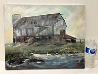 Full view of oil painting showing barn, pond with birds, and artist signature with water bottle for size reference.