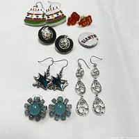 Displays full set laid out on white background showing all eight pairs including sporty logos and colorful fun designs.